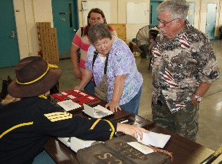 Visitors check out artifacts